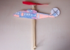 Rubber band powered model helicopter made of wood and card