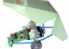 Shows Robo Car chassis with pcb mounted on it and the body shell tipped open