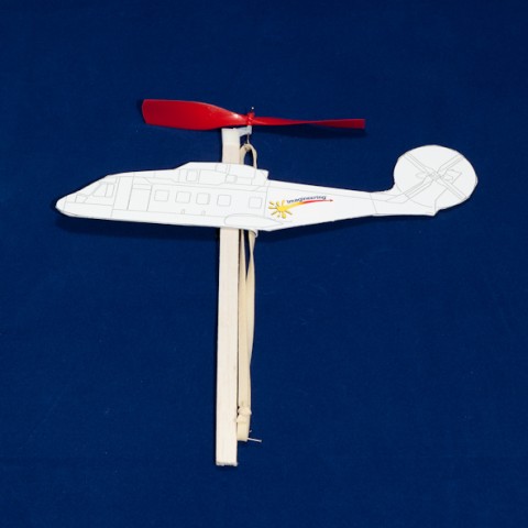 Rubber band powered model helicopter made of wood and card